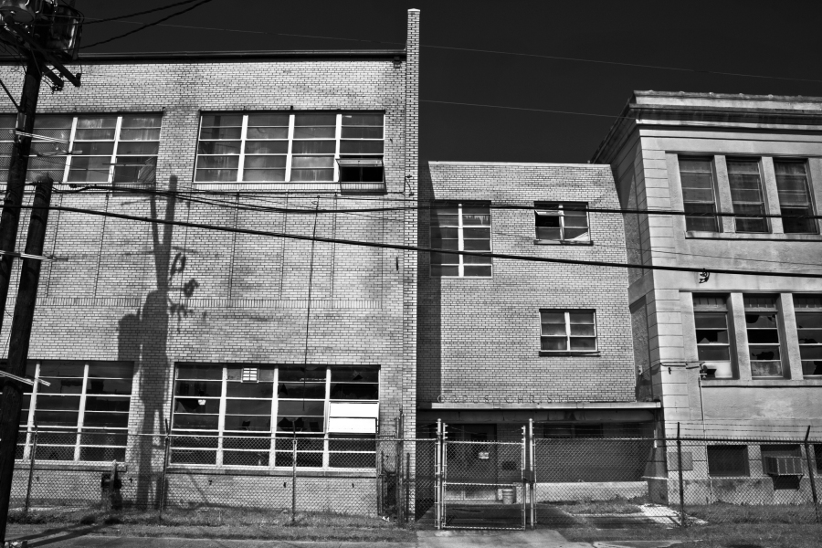 A black and white image of the now closed Corpus Christi school located in the 7th Ward of New Orleans, LA.