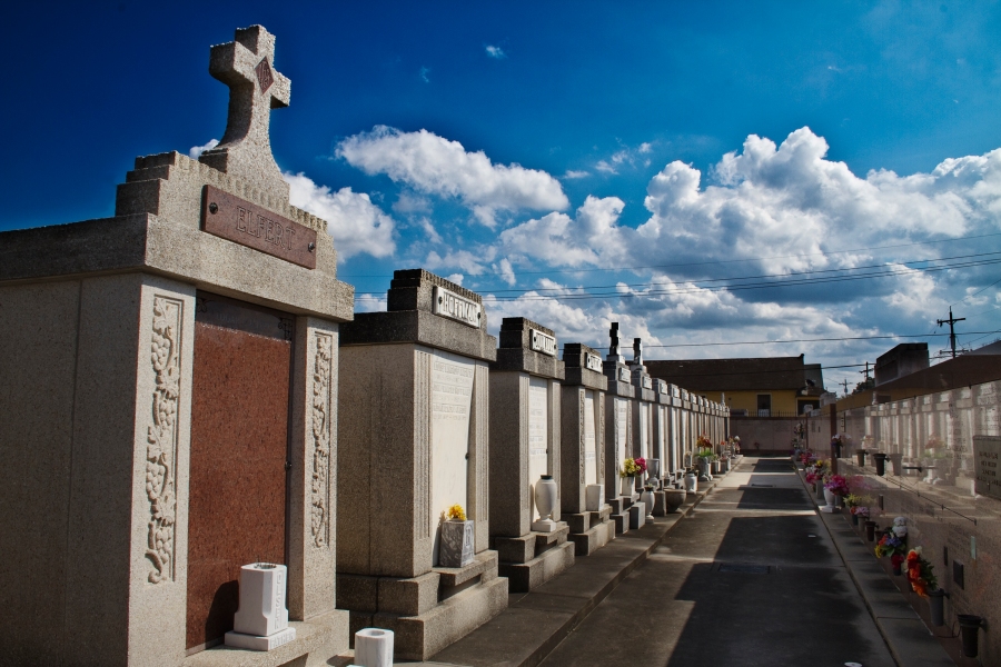 Crypts and a blue cloudy sky at St. Roch Cemetery in New Orleans, LA